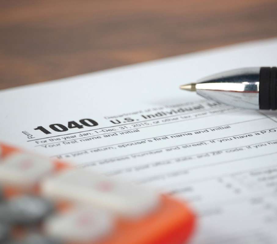Tax preparation services with calculator and forms