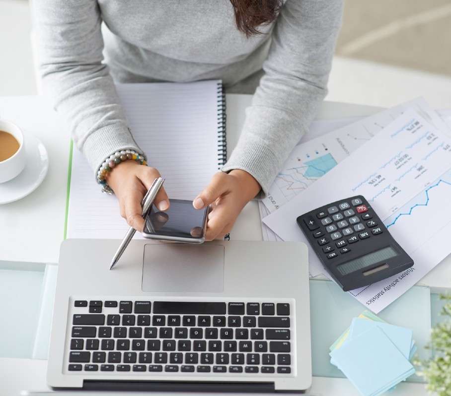Close-up of accounting paperwork and a calculator.