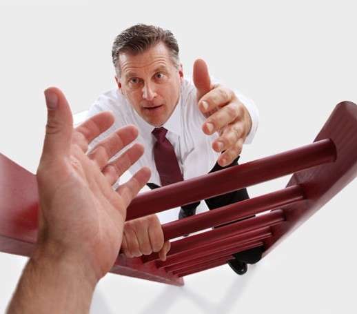 A person looking stressed over documents
